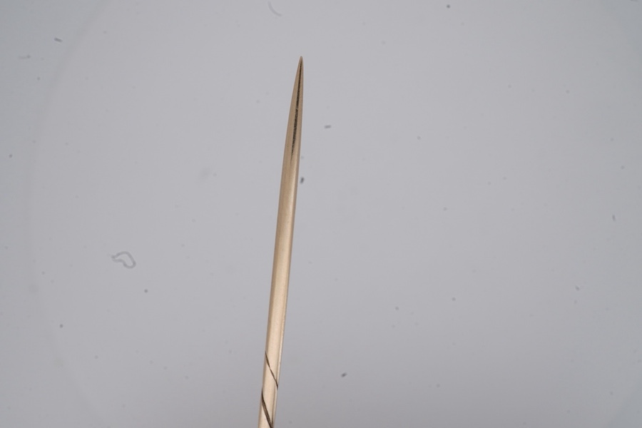 A Victorian gold and diamond stick pin, late 19th century, of circular outline with rope twist and grainti decoration, centring on a rose-cut diamond, length 7cm, gross weight 3 grams